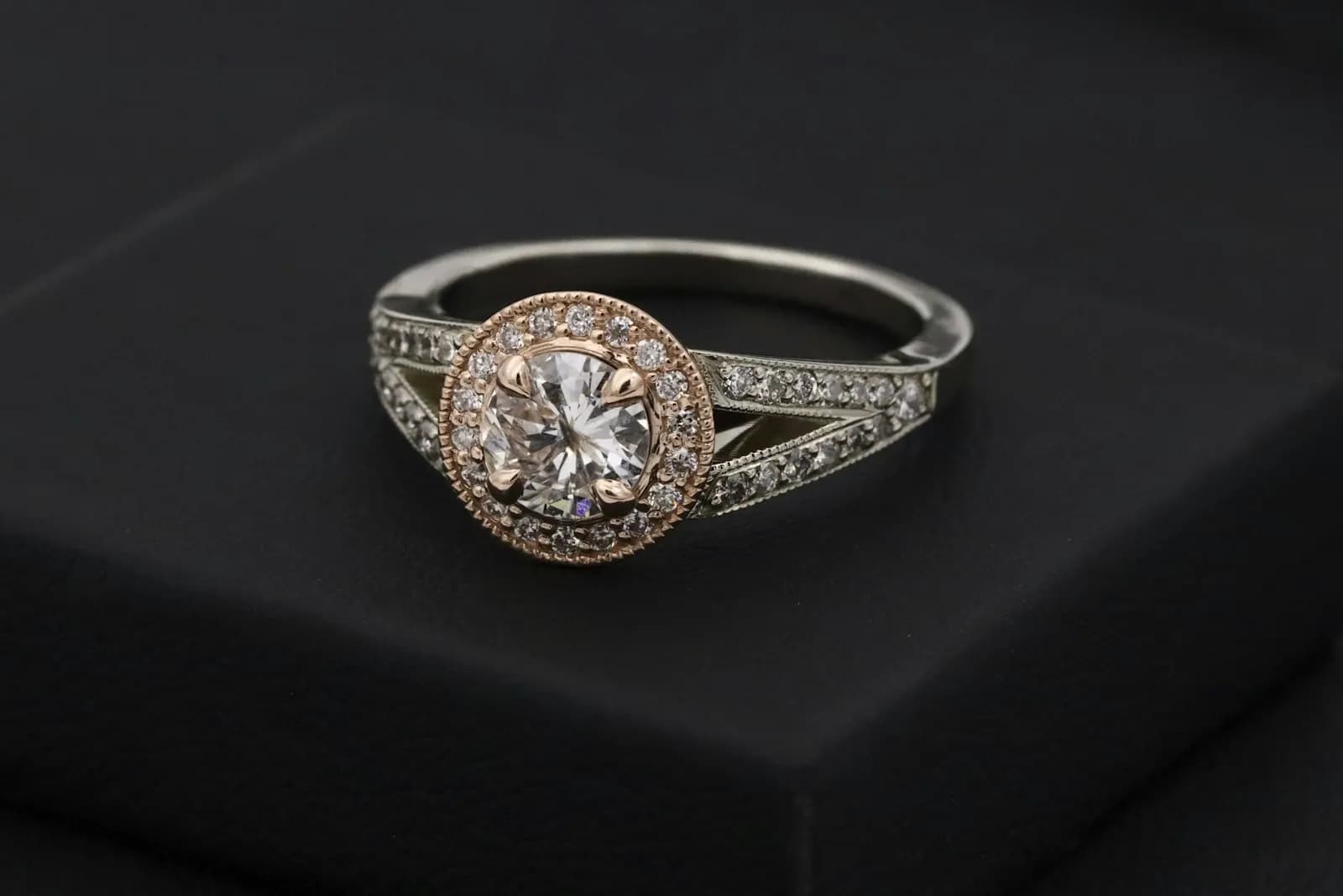 Stone-set ring with a halo and split band